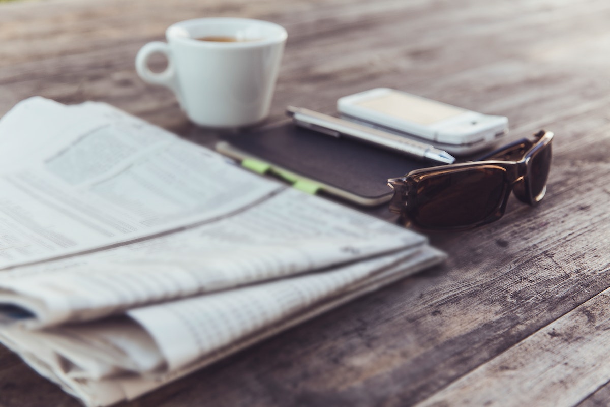 Cup of coffee and a newspaper